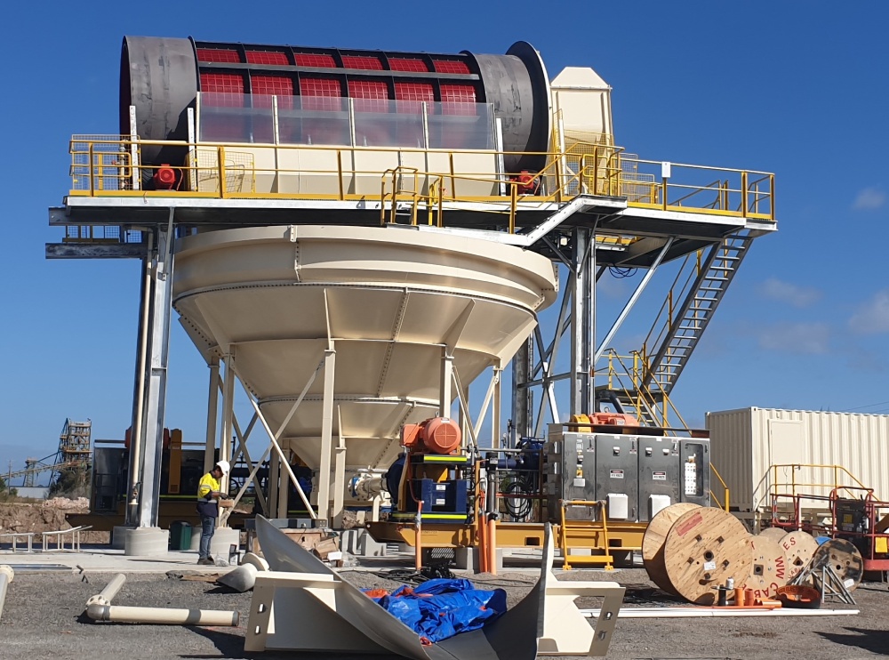 A large machine is sitting on a construction site.
